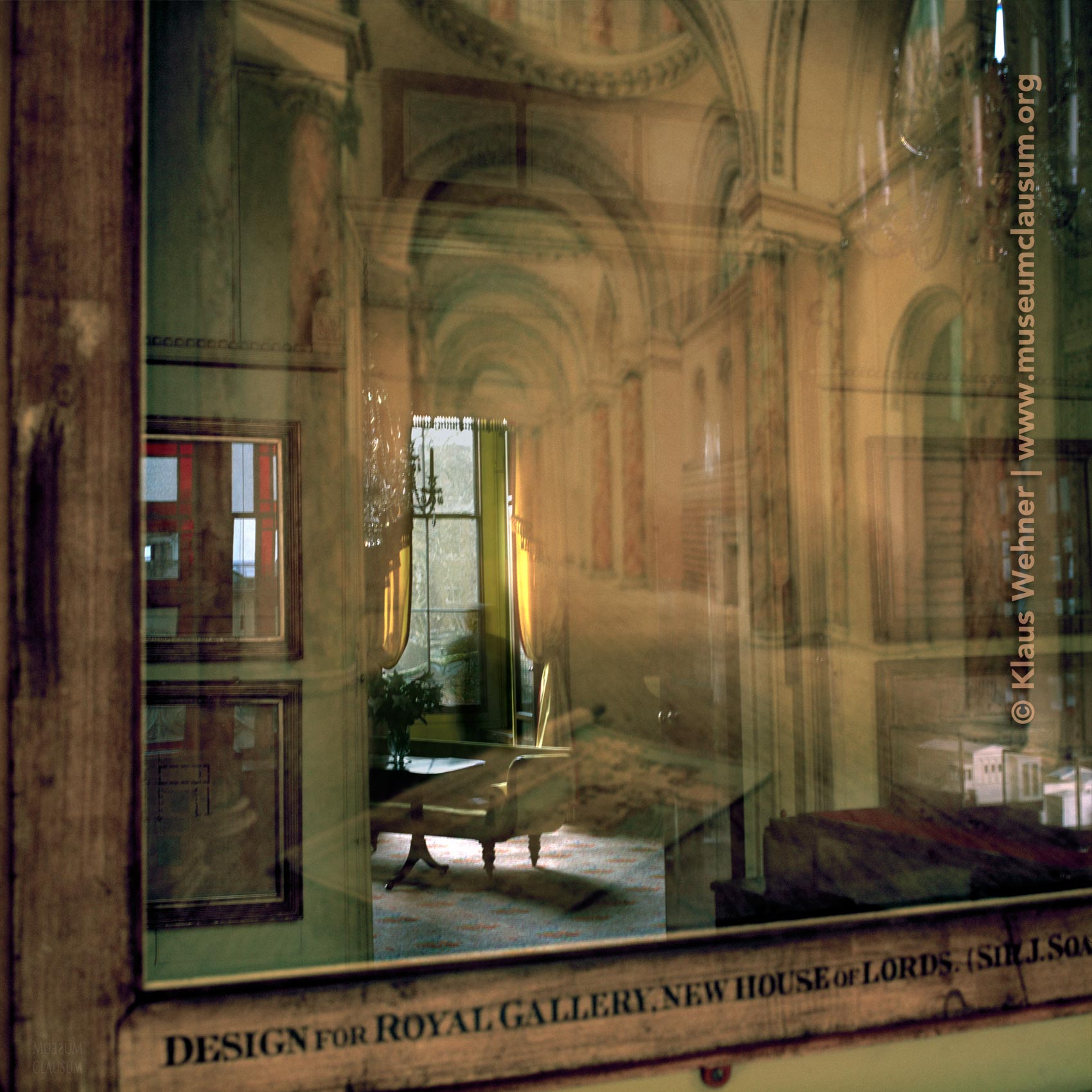 Sir John Soane's Museum: A blurred silhouette in the South Drawing room reflected in glass frame.