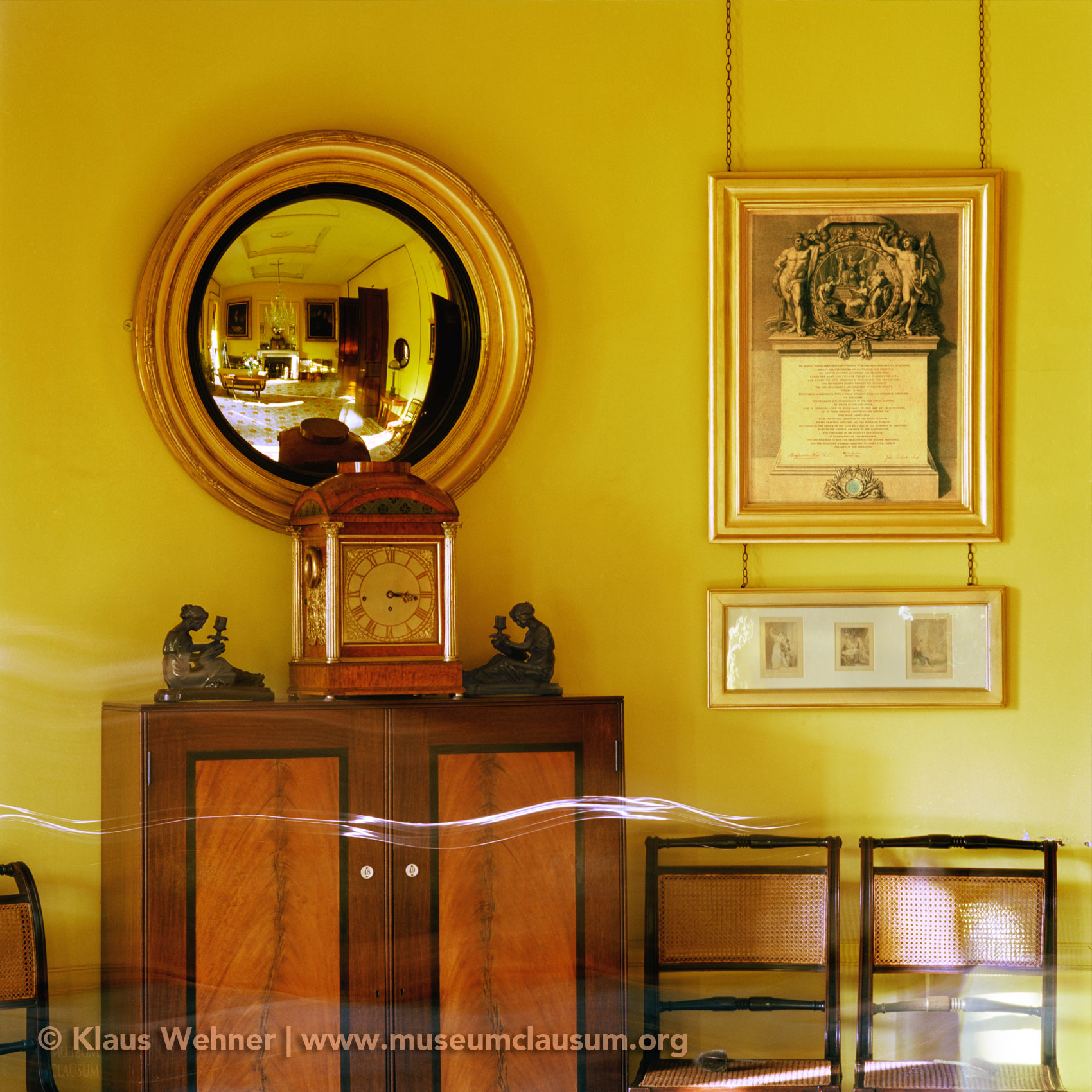 Sir John Soane's Museum: The South Drawing Room showing the clock and the room reflected in a roud convex mirror.