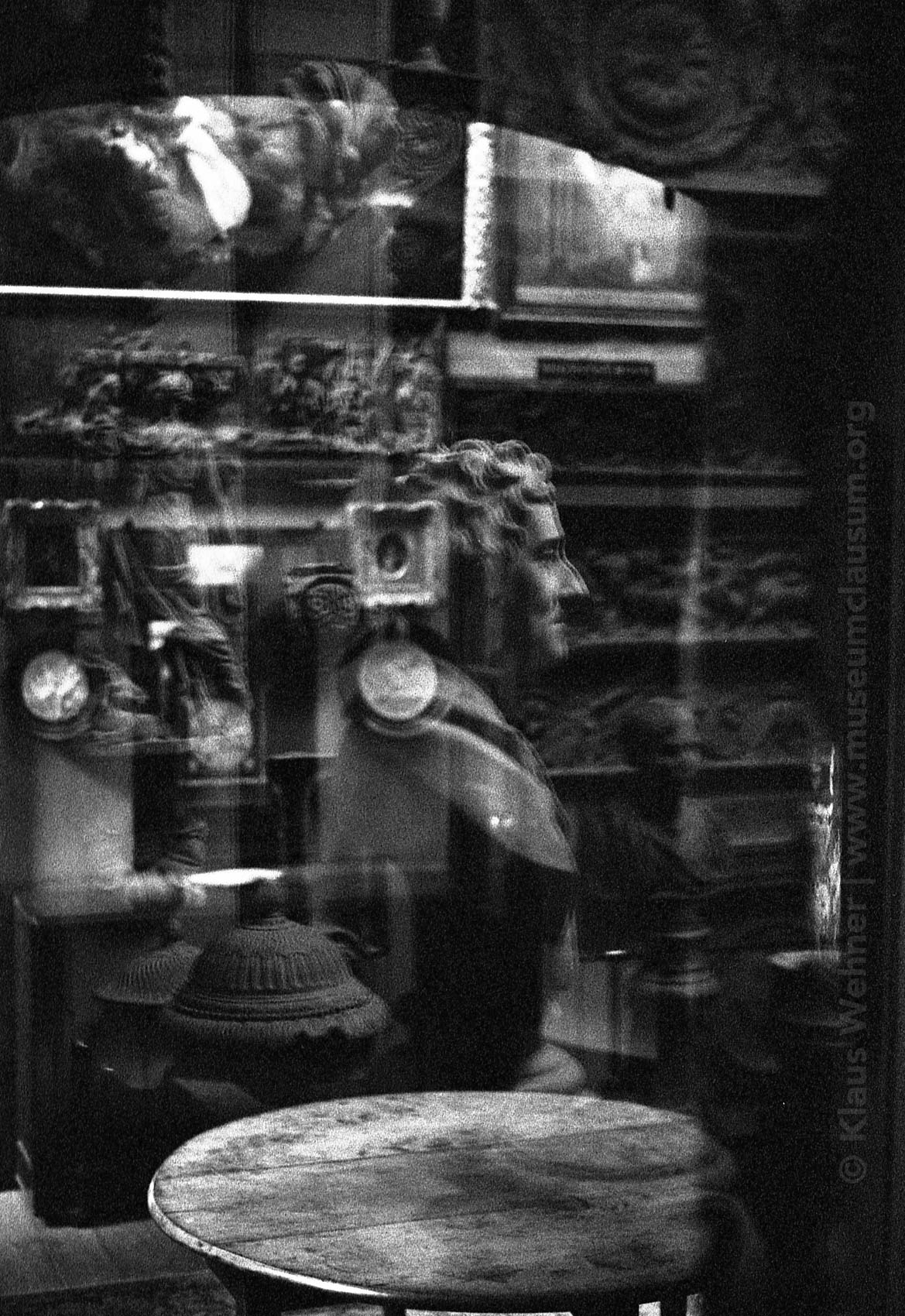 Sir John Soane's Museum: Black and white image showing a view into the Breakfast Room with the Dome with Soane's bust overlaid in a reflection.